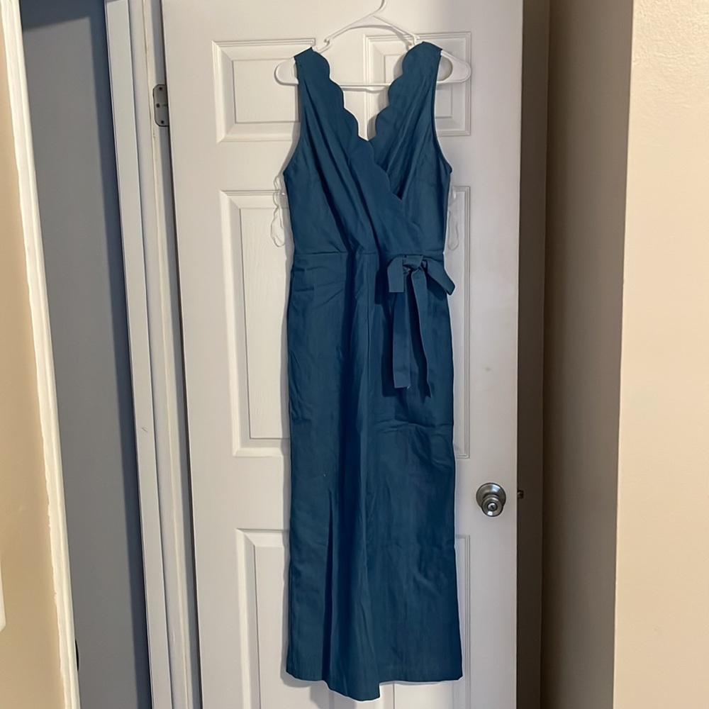 Women’s jumpsuit. Denim with scallop neckline.